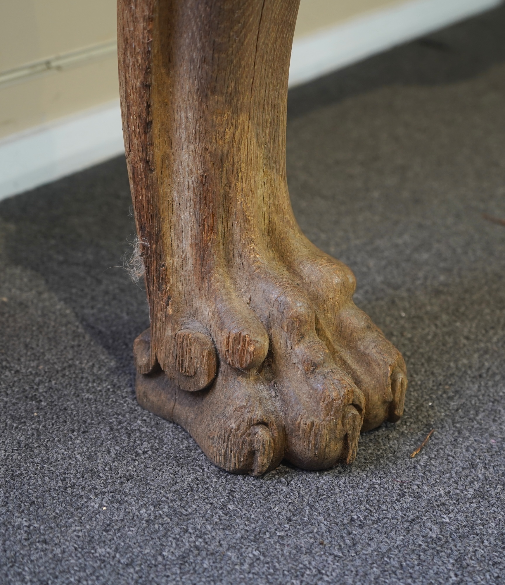 A 19th century Baroque style marble topped limed oak serpentine console table